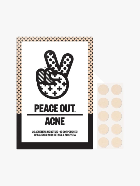 Peace Out Acne Healing Dots box with a peace sign illustration on it with  a sheet of beige pimple patches to the side on light gray background